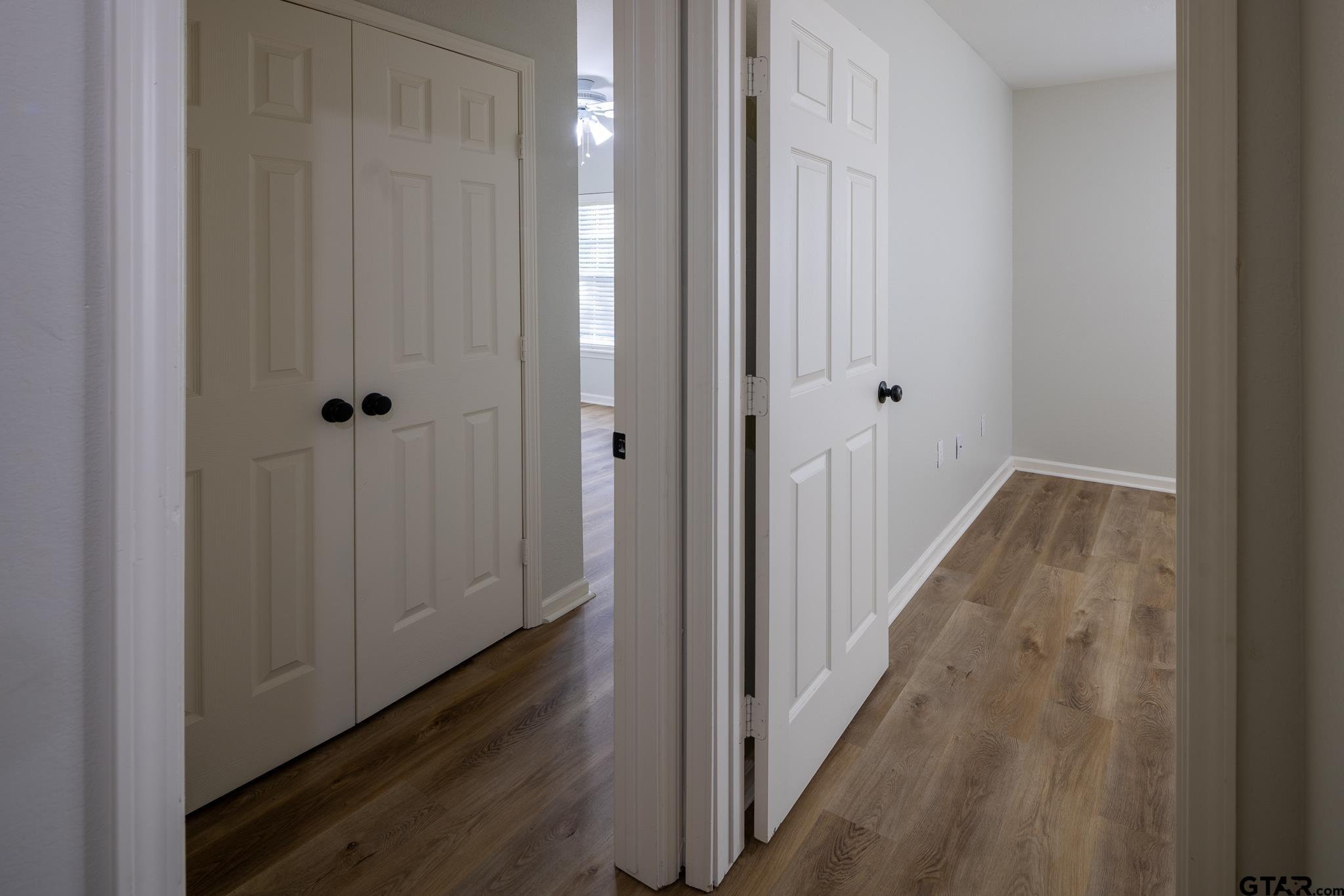 2802 Pollard Drive Tyler, TX 75701 - Photo 14 of 38 a view of a hallway with wooden floor