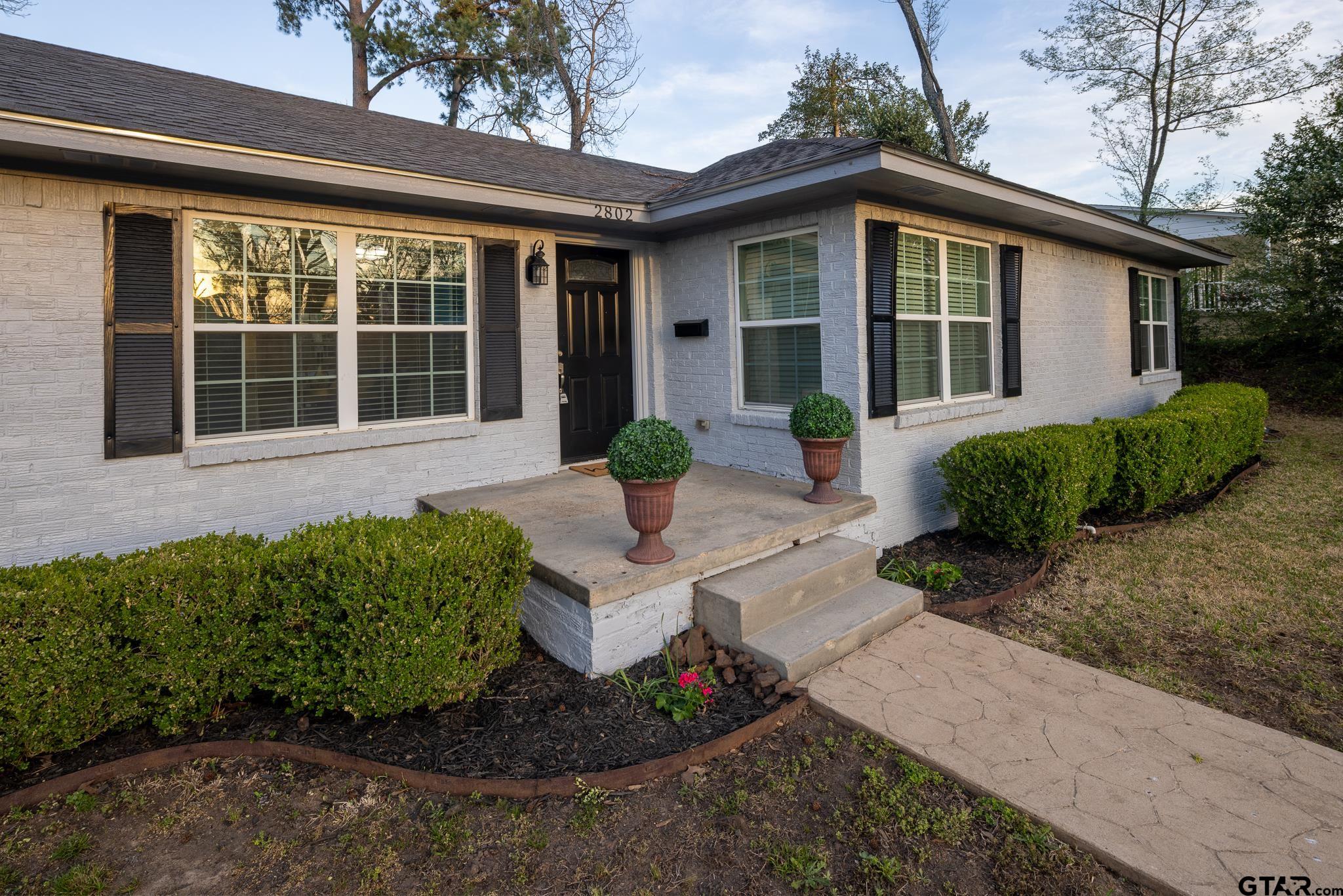 2802 Pollard Drive Tyler, TX 75701 - Photo 2 of 38 a front view of a house with garden