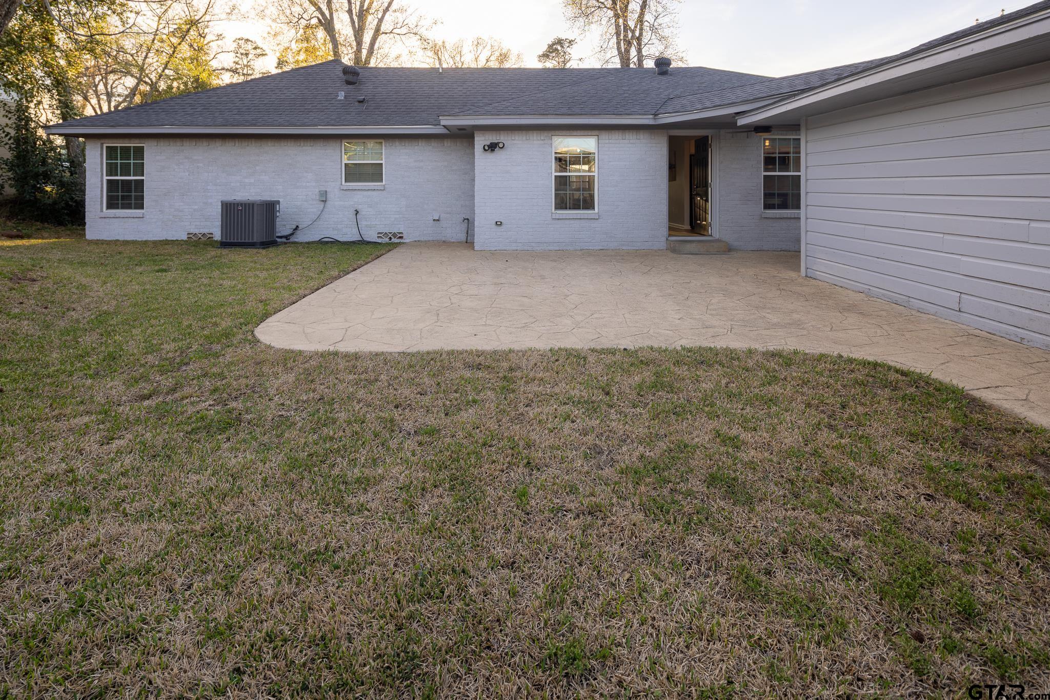 2802 Pollard Drive Tyler, TX 75701 - Photo 27 of 38 a view of a house with a yard and garage