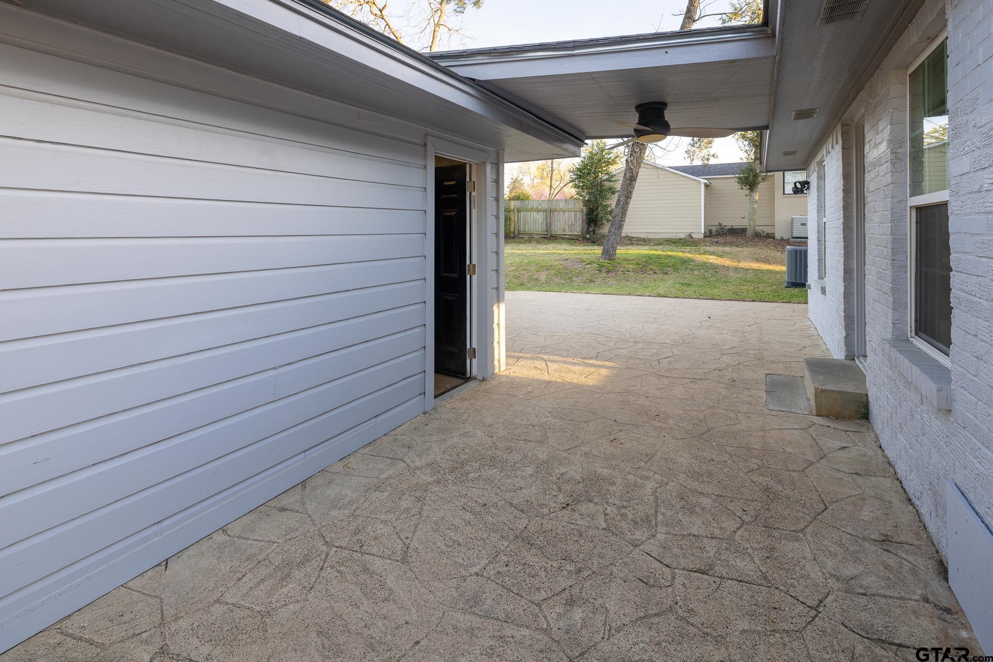 2802 Pollard Drive Tyler, TX 75701 - Photo 28 of 38 a view of a porch with furniture and garden