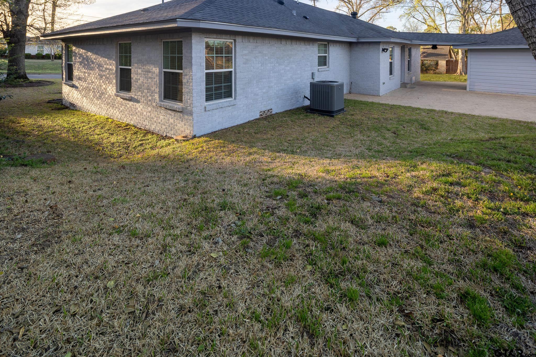 2802 Pollard Drive Tyler, TX 75701 - Photo 29 of 38 a front view of a house with a yard