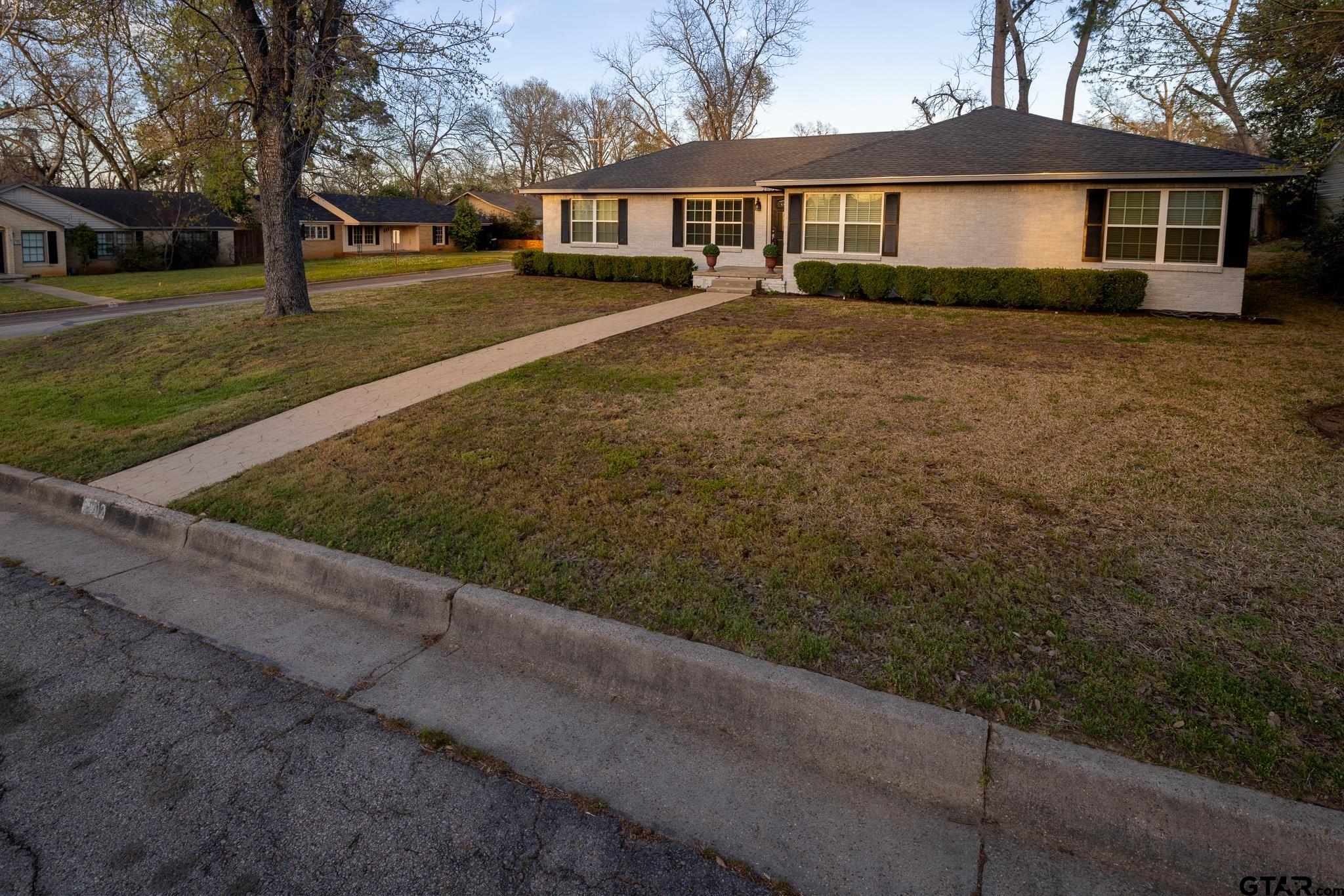 2802 Pollard Drive Tyler, TX 75701 - Photo 36 of 38 a front view of a house with a yard