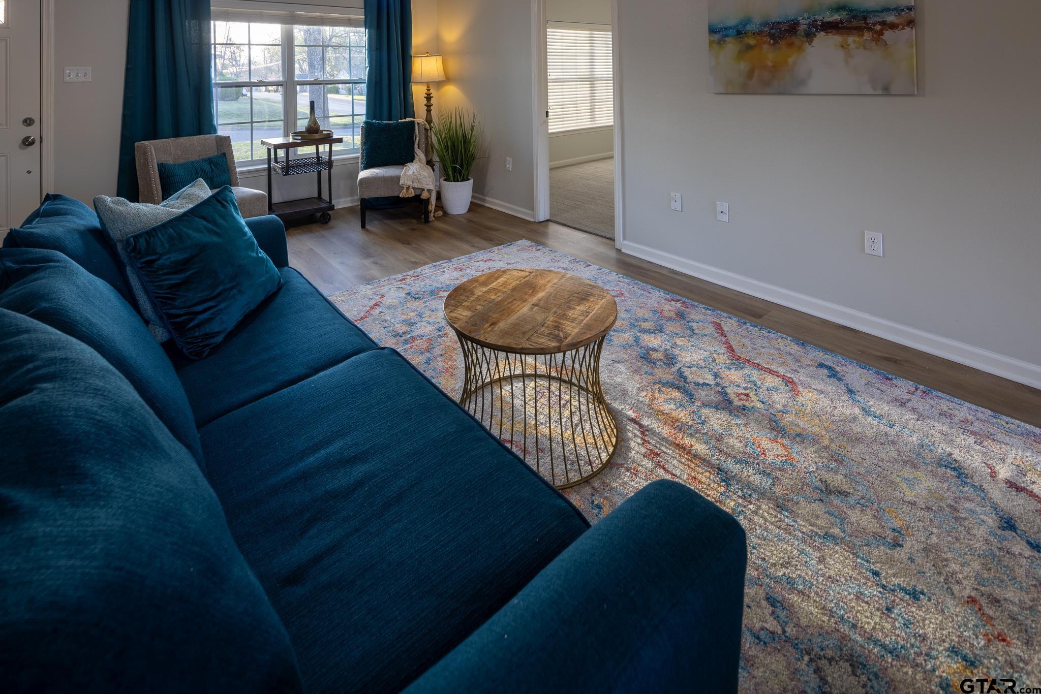 2802 Pollard Drive Tyler, TX 75701 - Photo 4 of 38 a living room with furniture and a large window