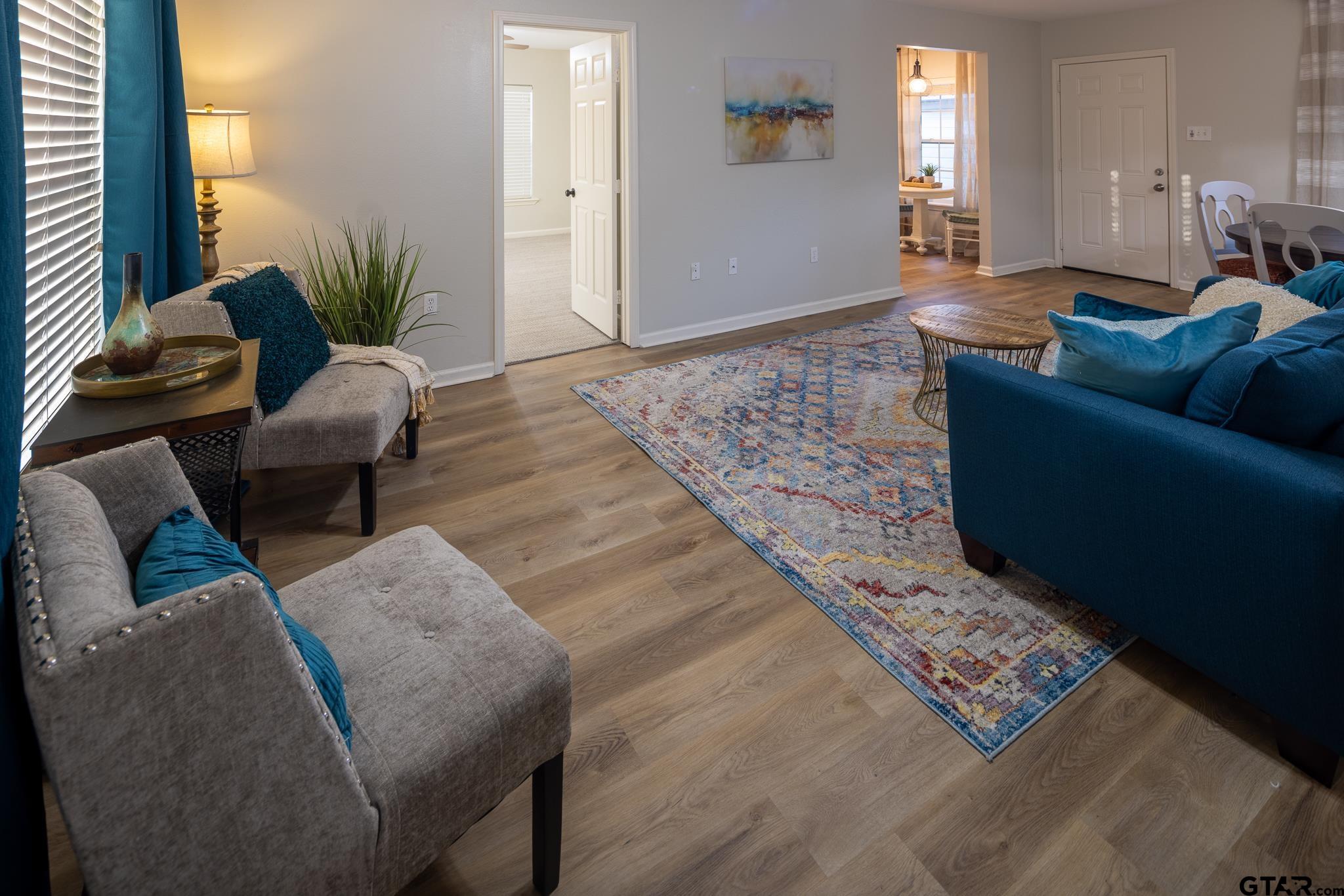 2802 Pollard Drive Tyler, TX 75701 - Photo 5 of 38 a living room with furniture and a rug