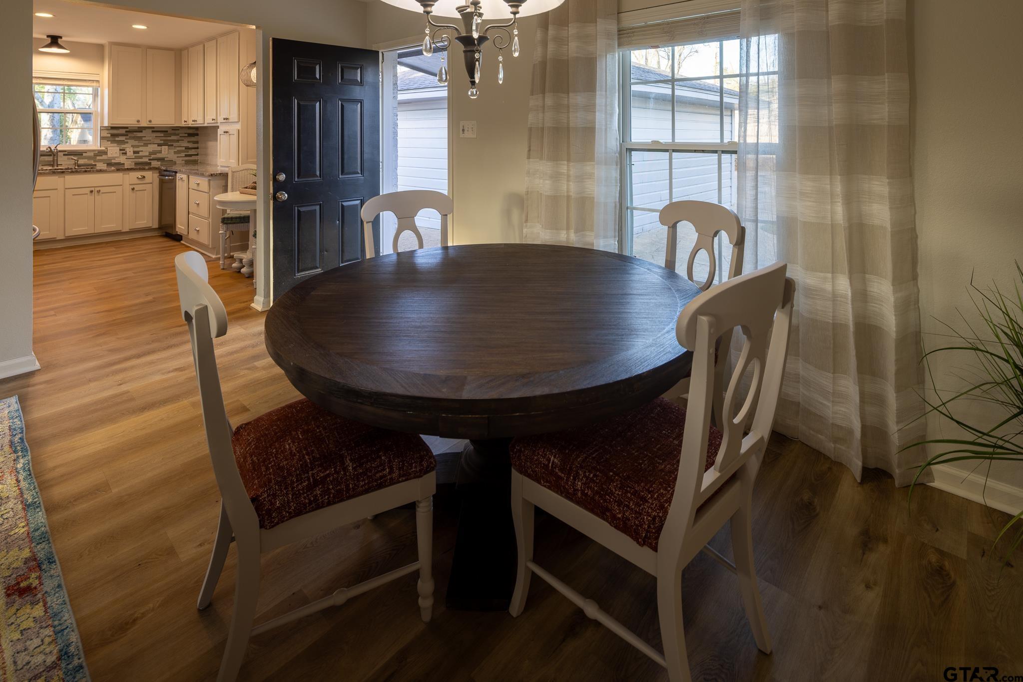 2802 Pollard Drive Tyler, TX 75701 - Photo 6 of 38 a dining room with furniture and wooden floor