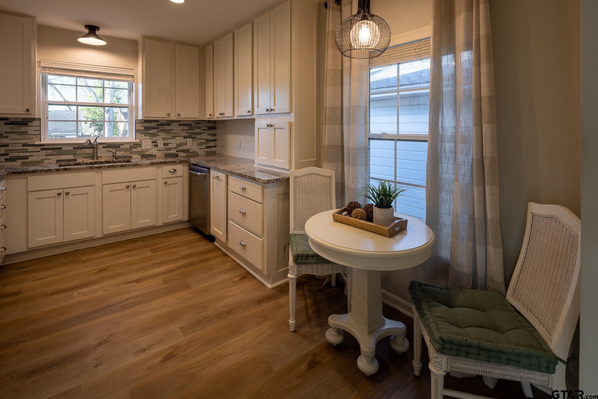 2802 Pollard Drive Tyler, TX 75701 - Photo 9 of 38 a kitchen with a sink cabinets and window