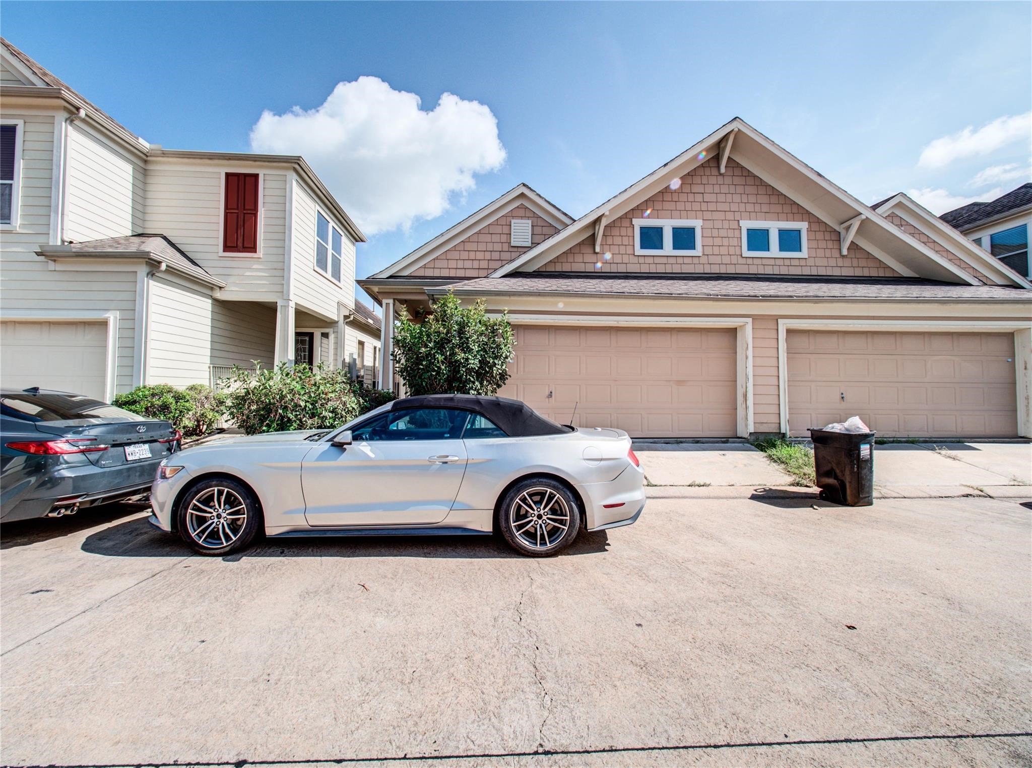 a view of parking space with a car parked in front of it