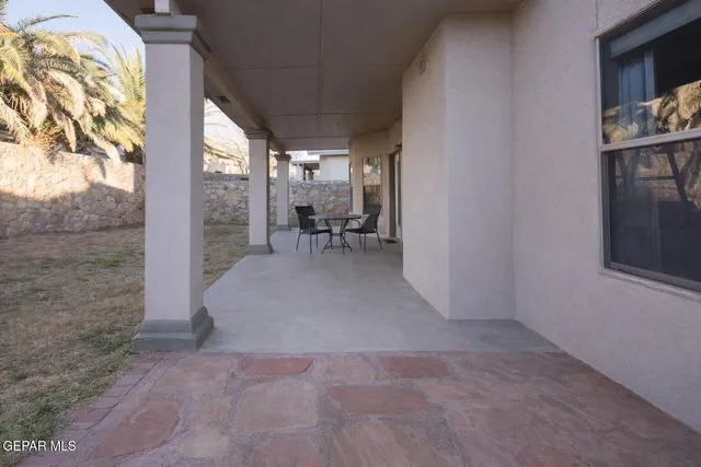 a view of living room with furniture and a window