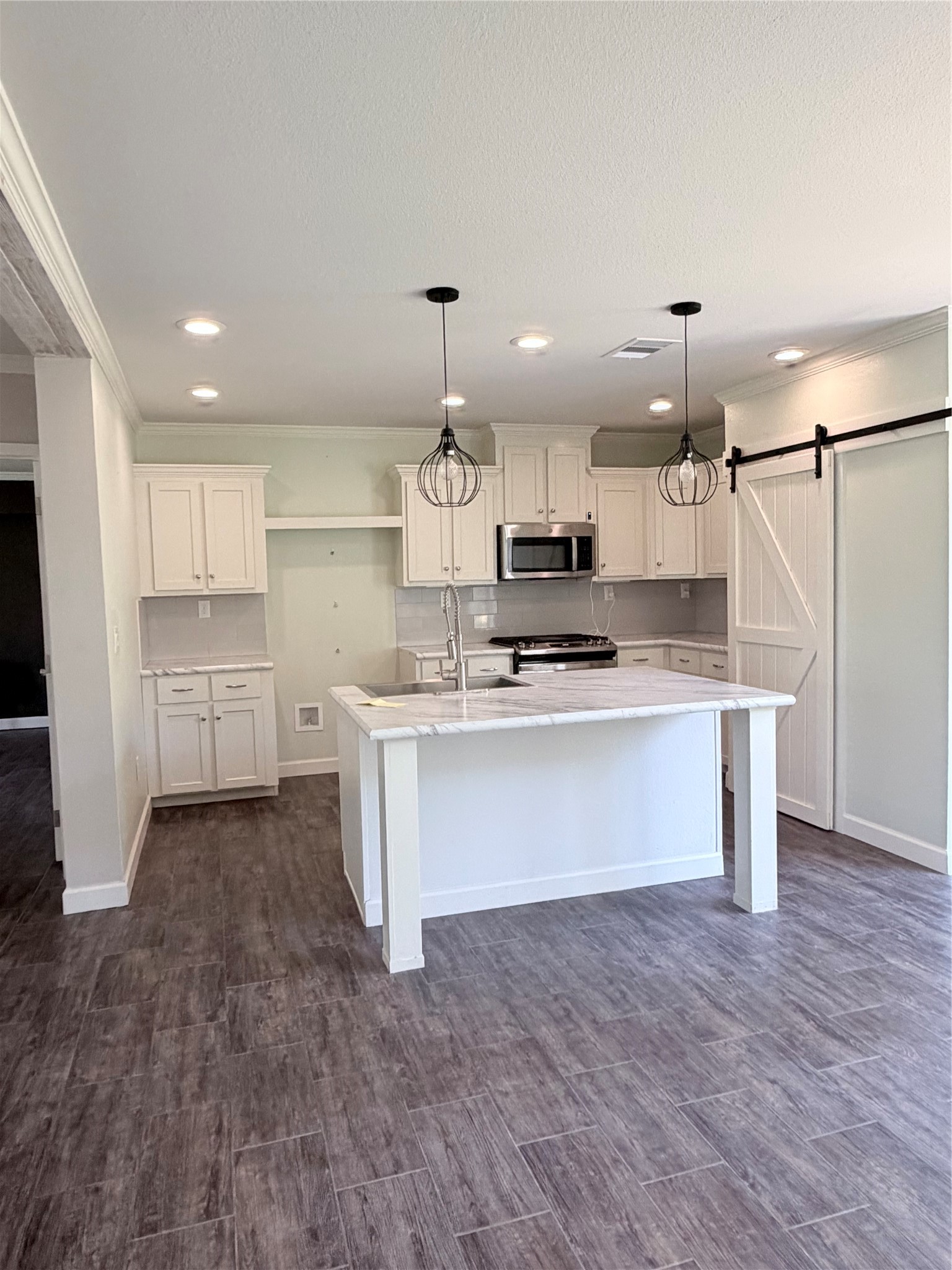 59 Forgotten Road Richards, TX 77873 - Photo 5 of 21 a kitchen with stainless steel appliances a refrigerator sink and cabinets