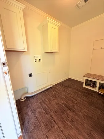 an empty room with wooden floor