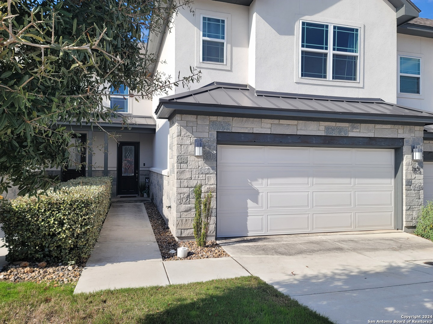 155 Magnolia Circle Boerne, TX 78006 - Photo 1 of 15 a front view of a house with garden