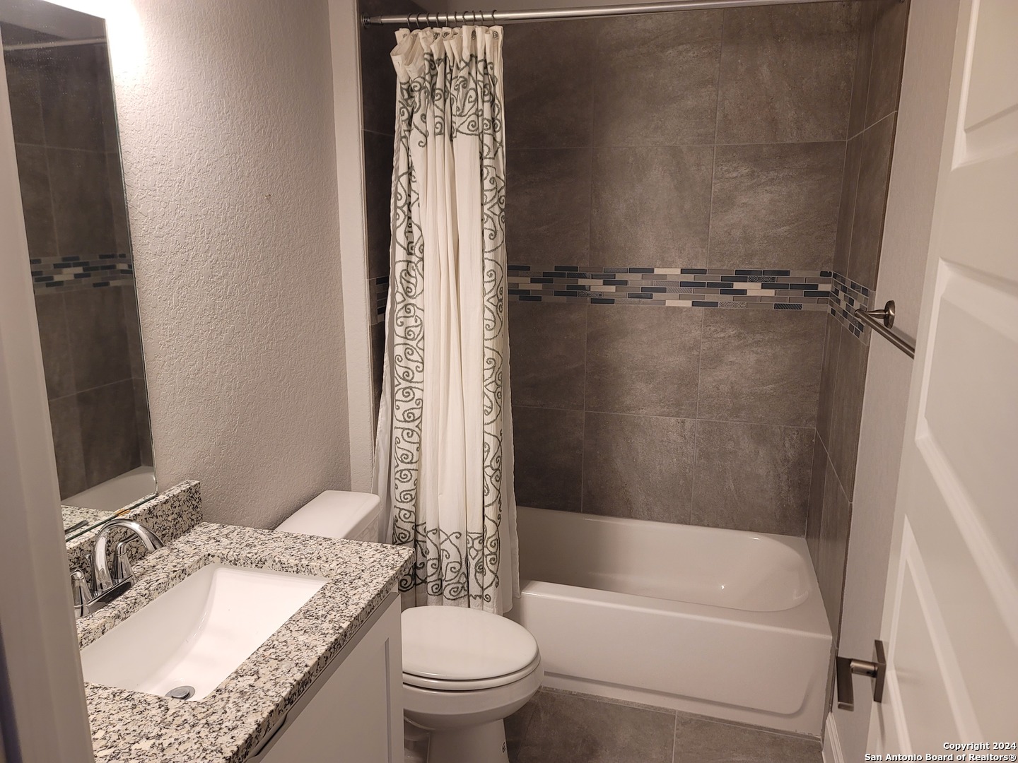 155 Magnolia Circle Boerne, TX 78006 - Photo 13 of 15 a bathroom with a granite countertop sink toilet and shower