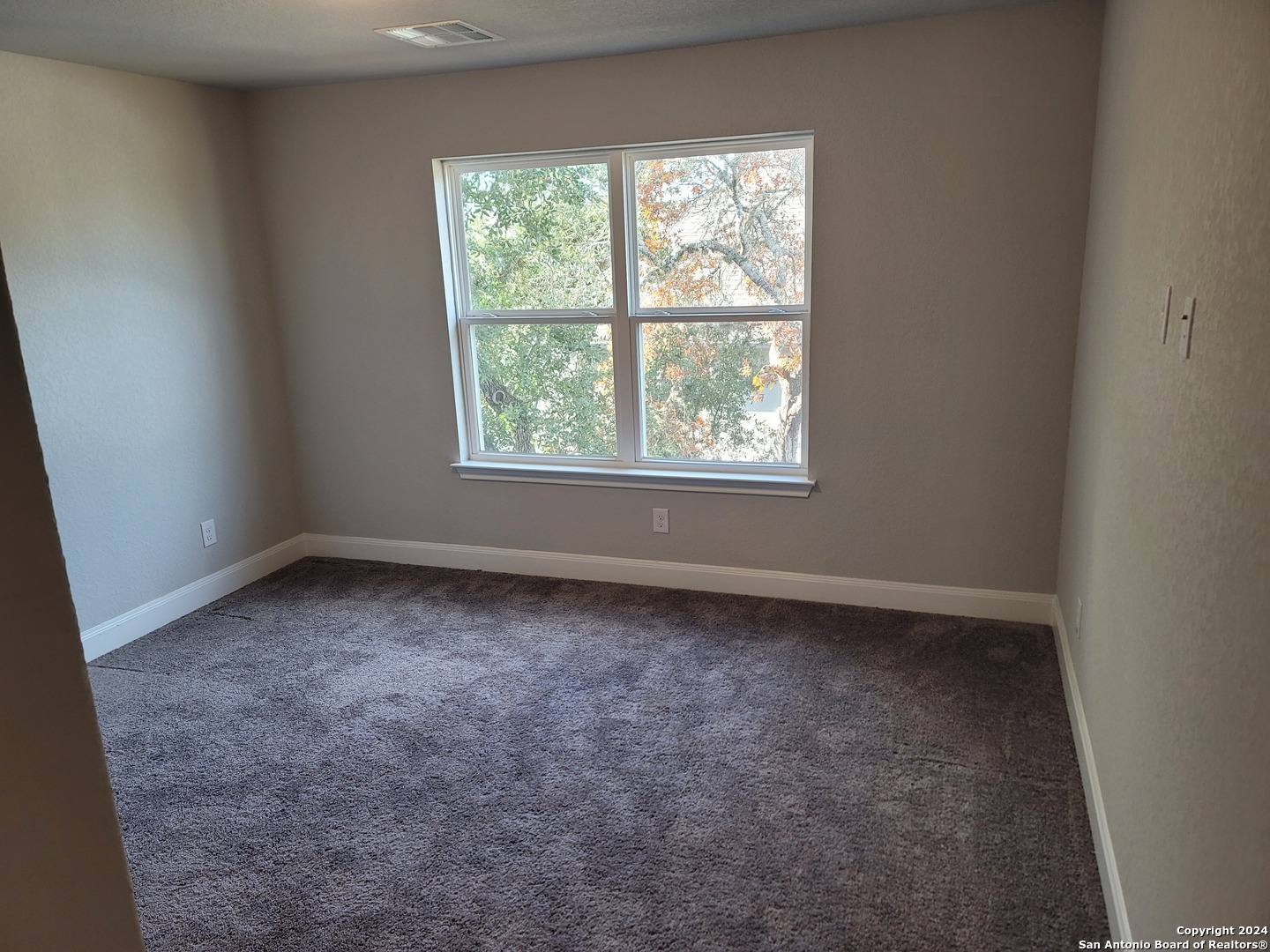 155 Magnolia Circle Boerne, TX 78006 - Photo 14 of 15 an empty room with a window