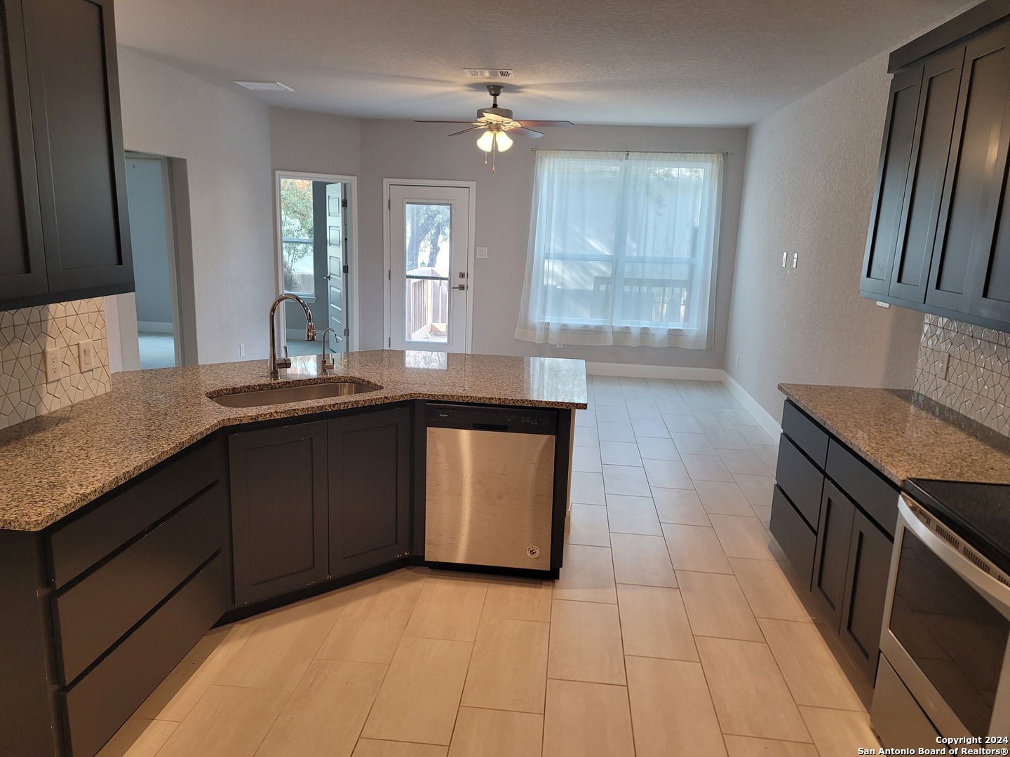 155 Magnolia Circle Boerne, TX 78006 - Photo 4 of 15 a kitchen with a sink stove and cabinets