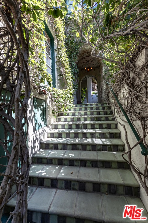 6740 Milner Road Los Angeles, CA 90068 - Photo 2 of 34 a front view of a house with a yard