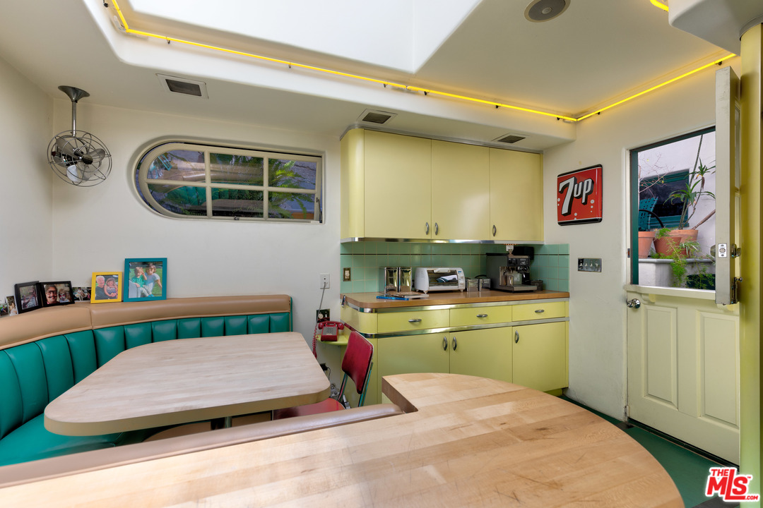 6740 Milner Road Los Angeles, CA 90068 - Photo 11 of 34 a bedroom with a bed and cabinets