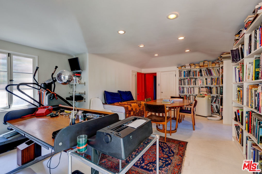 6740 Milner Road Los Angeles, CA 90068 - Photo 19 of 34 a living room with lots of furniture and book shelf