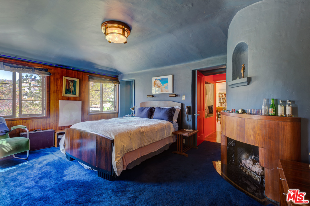 6740 Milner Road Los Angeles, CA 90068 - Photo 24 of 34 a bedroom with a bed and a tv on dresser