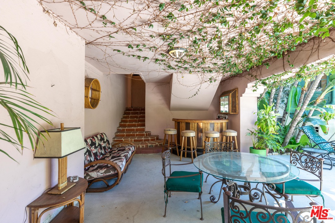 6740 Milner Road Los Angeles, CA 90068 - Photo 32 of 34 a view of a porch with furniture and a potted plant