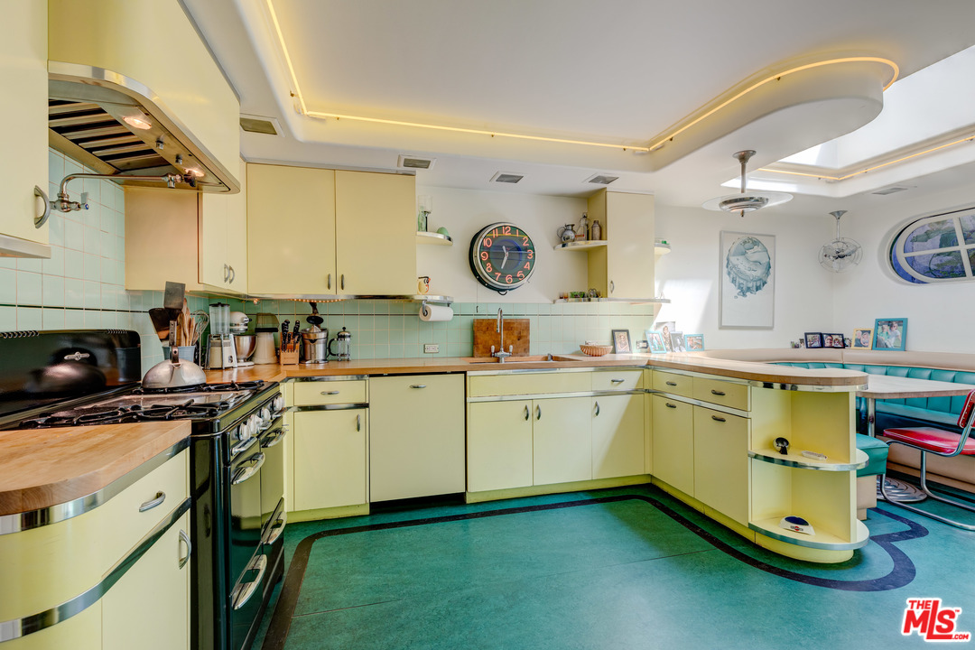 6740 Milner Road Los Angeles, CA 90068 - Photo 9 of 34 a kitchen with a sink cabinets and window