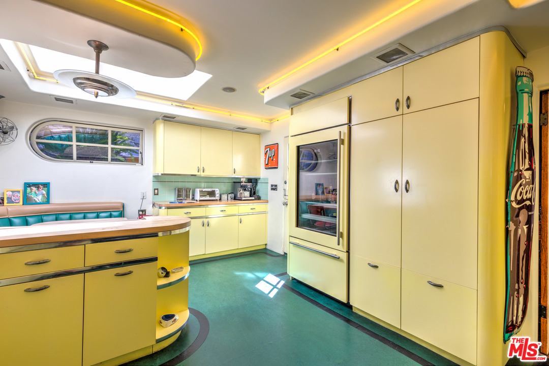 6740 Milner Road Los Angeles, CA 90068 - Photo 10 of 34 a kitchen with cabinets a sink and appliances