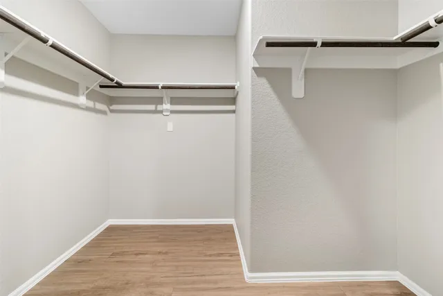 a view of an empty walk in closet