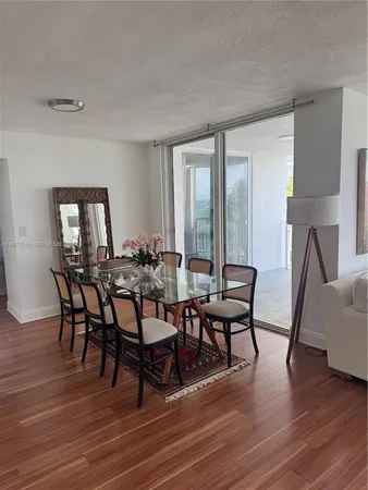 a view of a livingroom with furniture and wooden floor