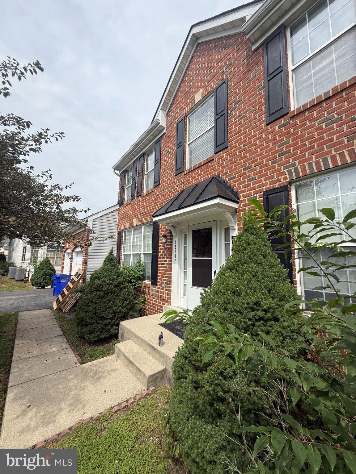 15202 Jenkins Ridge Road Bowie, MD 20721 - Photo 1 of 1 Charming brick facade with lush greenery.