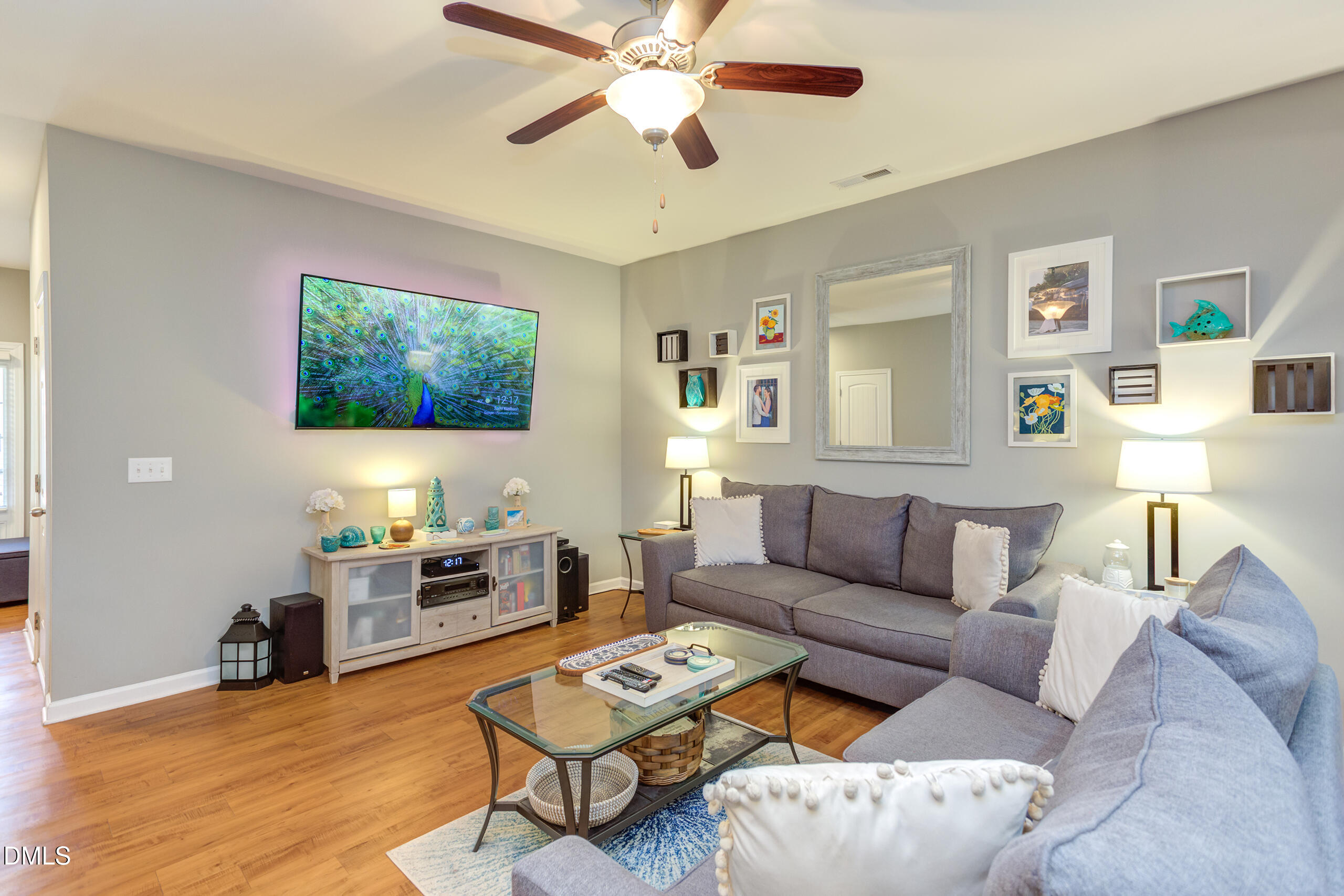 1434 Chatuga Way Wake Forest, NC 27587 - Photo 5 of 29 a living room with furniture and a flat screen tv