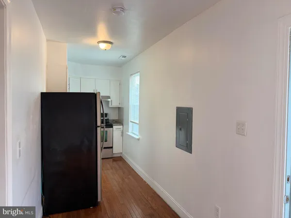 a kitchen with a refrigerator stove and sink