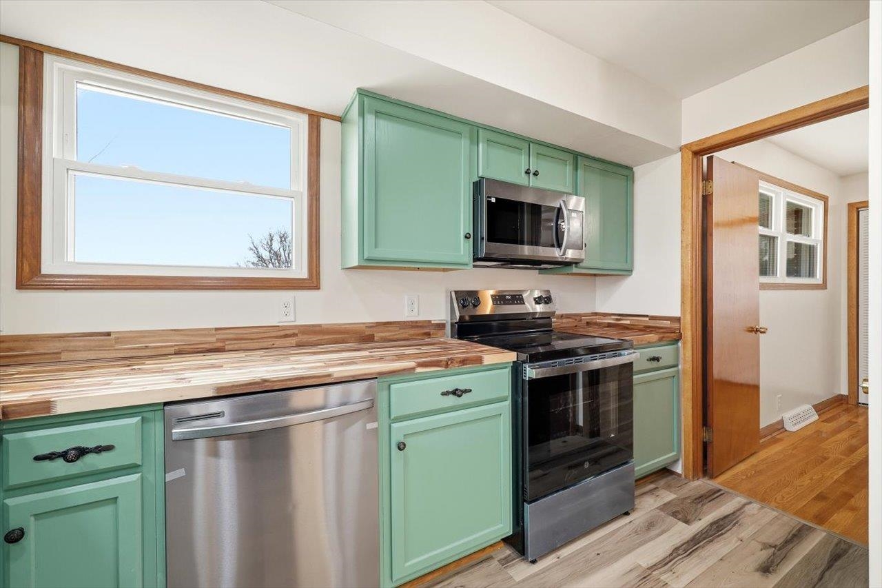 11 Partlow Street Staunton, VA 24401 - Photo 12 of 38 a kitchen with a stove microwave and sink