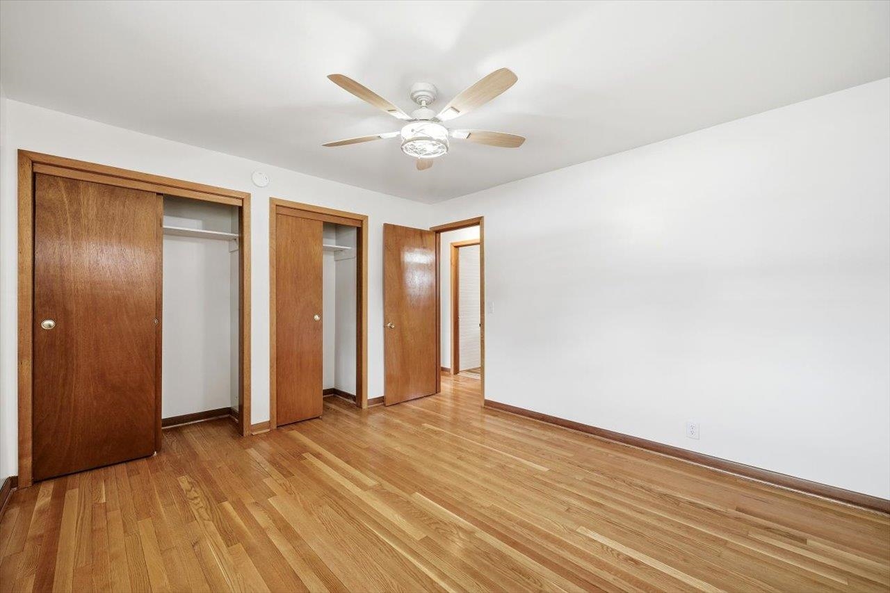 11 Partlow Street Staunton, VA 24401 - Photo 15 of 38 a view of an empty room with wooden floor and a ceiling fan