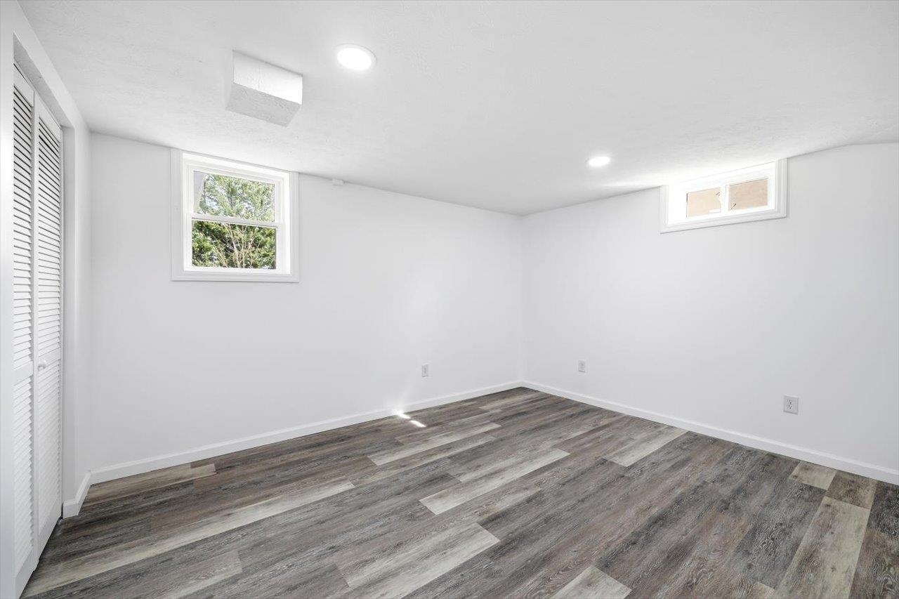11 Partlow Street Staunton, VA 24401 - Photo 27 of 38 an empty room with wooden floor and windows