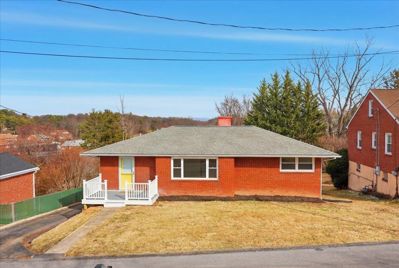 11 Partlow Street Staunton, VA 24401 - Photo 35 of 38 a front view of a house with a garden and yard