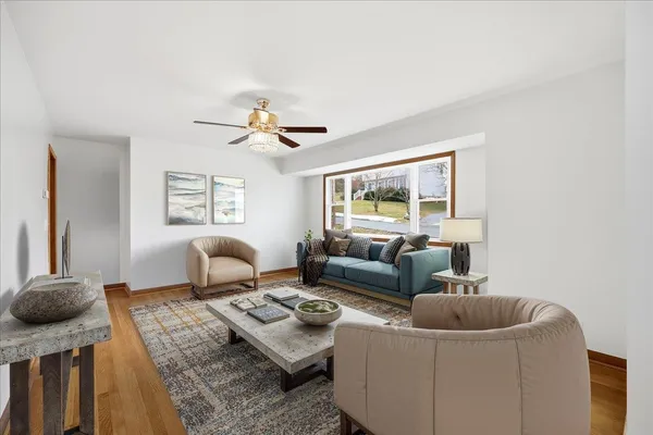 a living room with furniture and a window