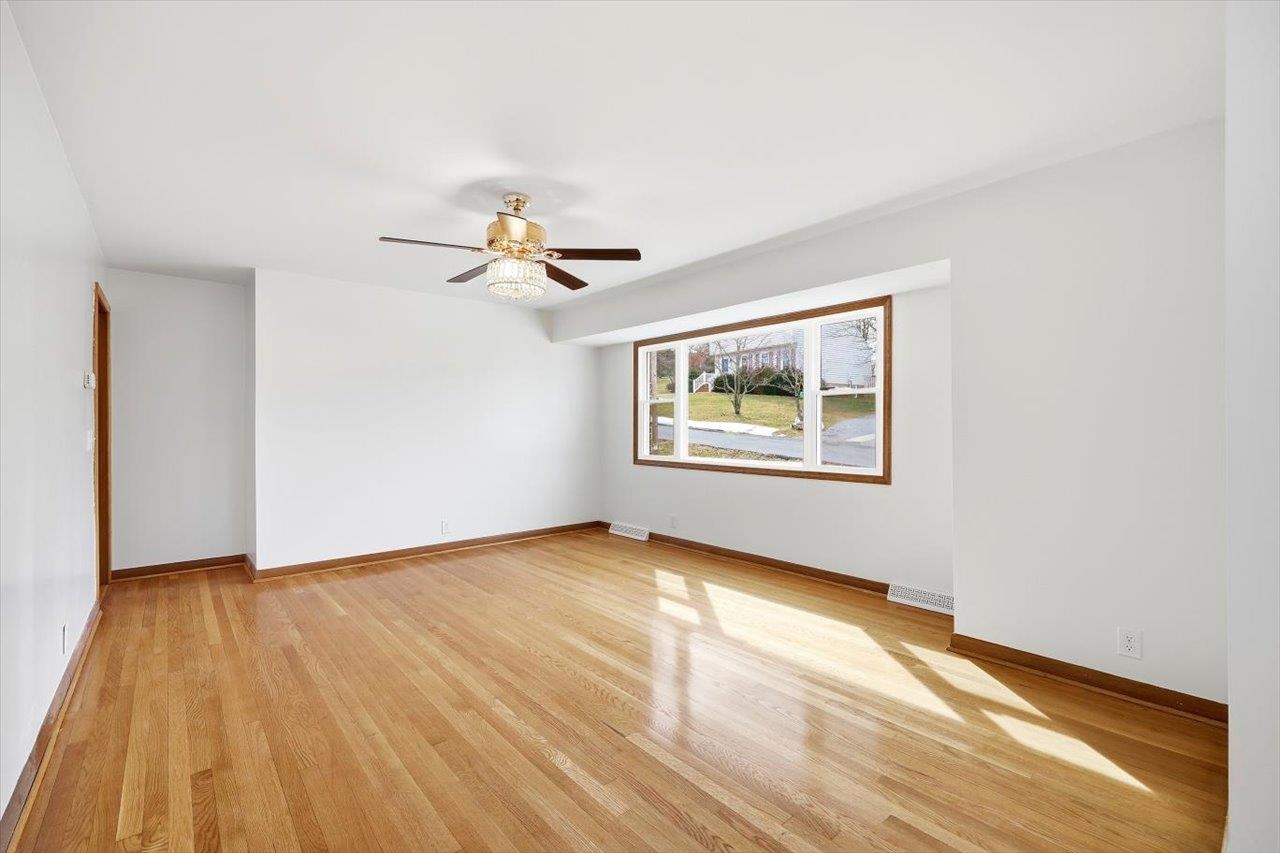 11 Partlow Street Staunton, VA 24401 - Photo 5 of 38 a view of an empty room with wooden floor