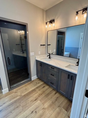 1184 West 3250 North Ogden, UT 84414 - Photo 30 of 69 Master bath featuring a dual vanity with a white quartz countertop, matte black fixtures, walk-in shower with glass door
