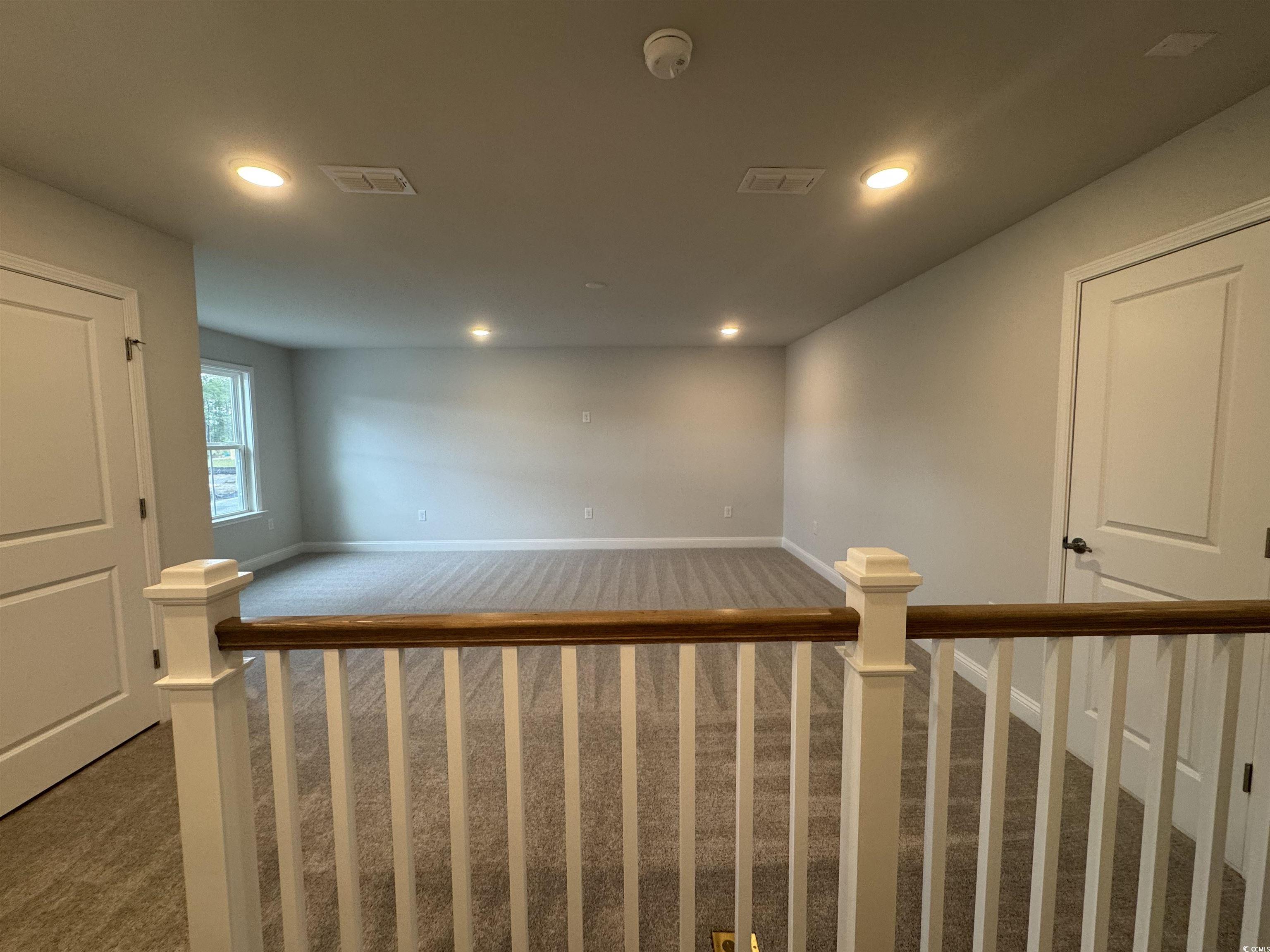 9409 Long Meadow Way Longs, SC 29568 - Photo 12 of 17 Staircase featuring carpet flooring, recessed ligh