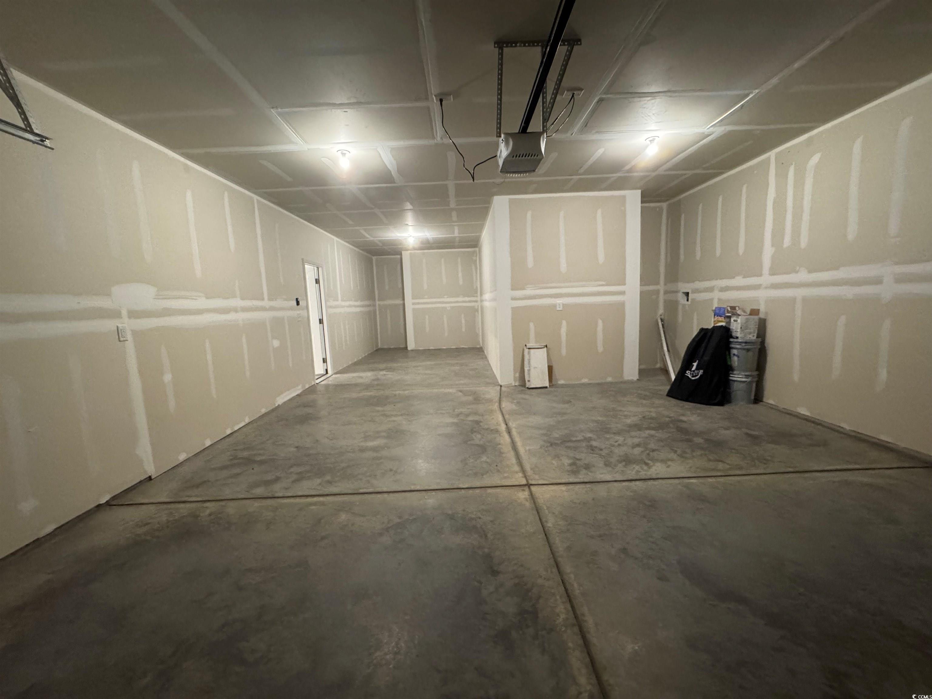 9409 Long Meadow Way Longs, SC 29568 - Photo 2 of 17 Garage with a garage door opener
