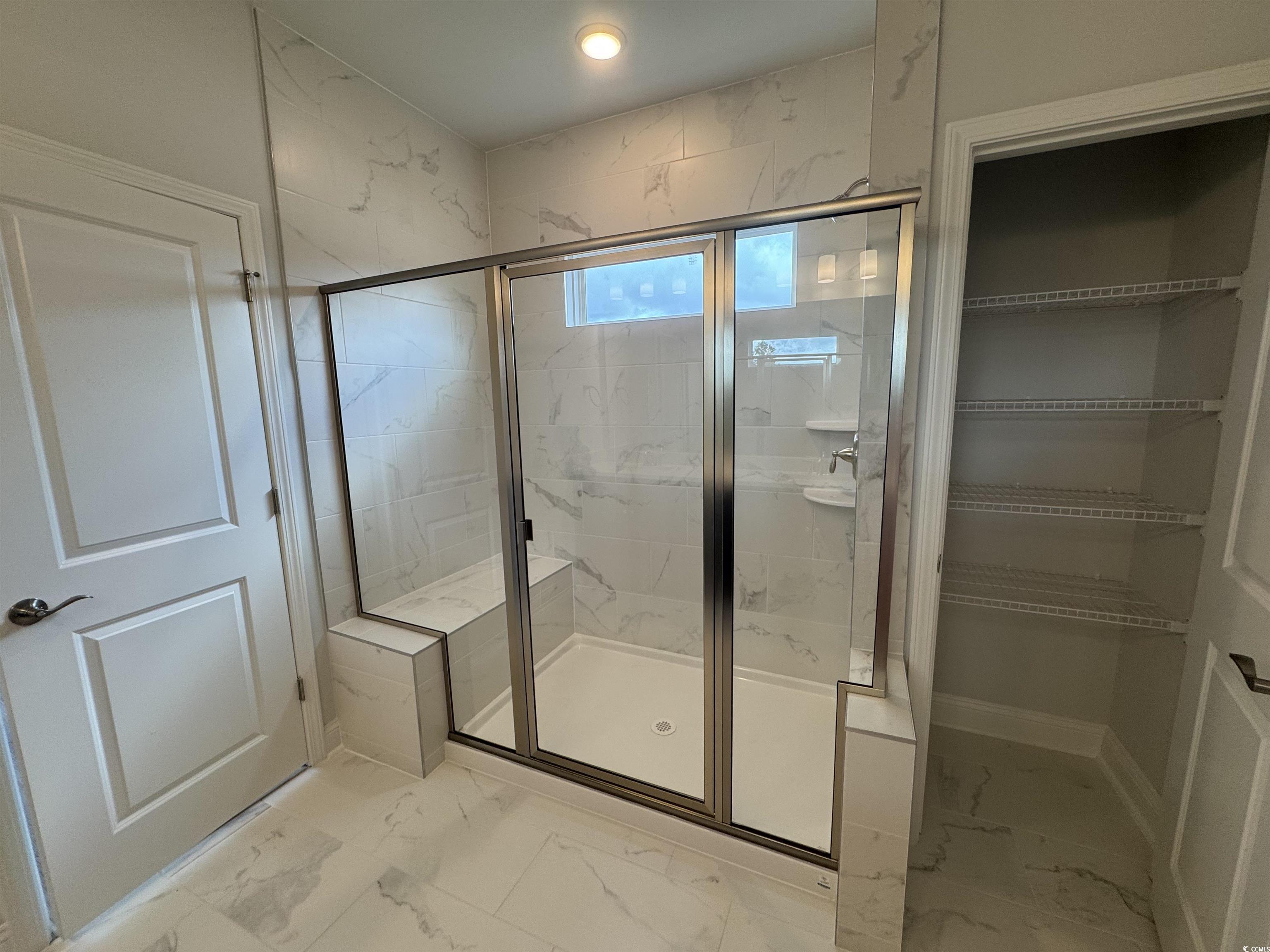 9409 Long Meadow Way Longs, SC 29568 - Photo 5 of 17 Full bath featuring marble look tiles, a shower st