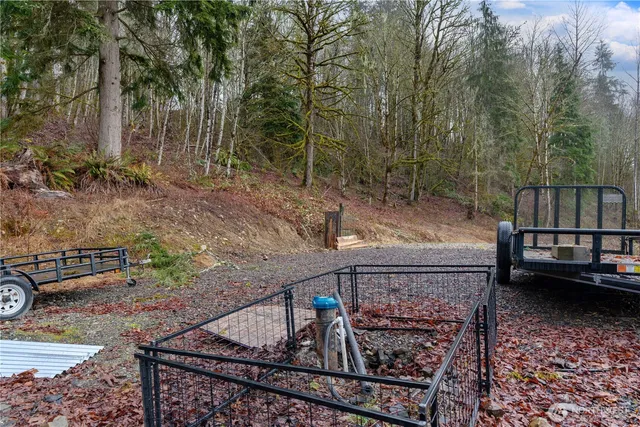 a view of a backyard with sitting area