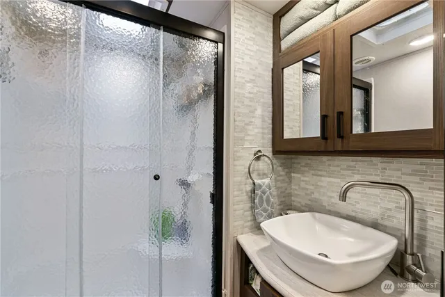 a bathroom with a sink and a mirror