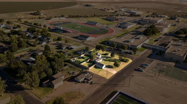 an aerial view of residential house with outdoor space