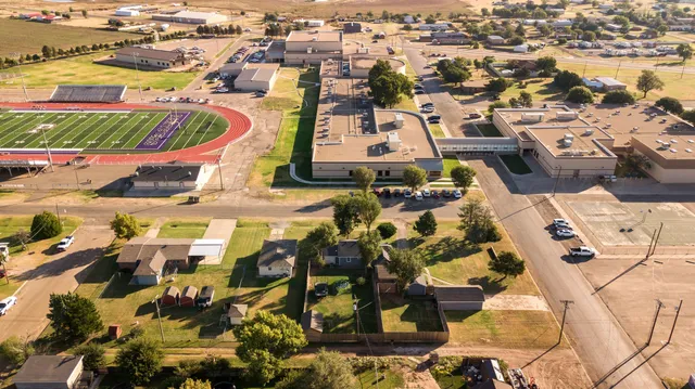 an aerial view of residential houses with outdoor space
