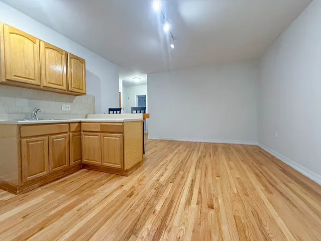 a kitchen with a sink and cabinets