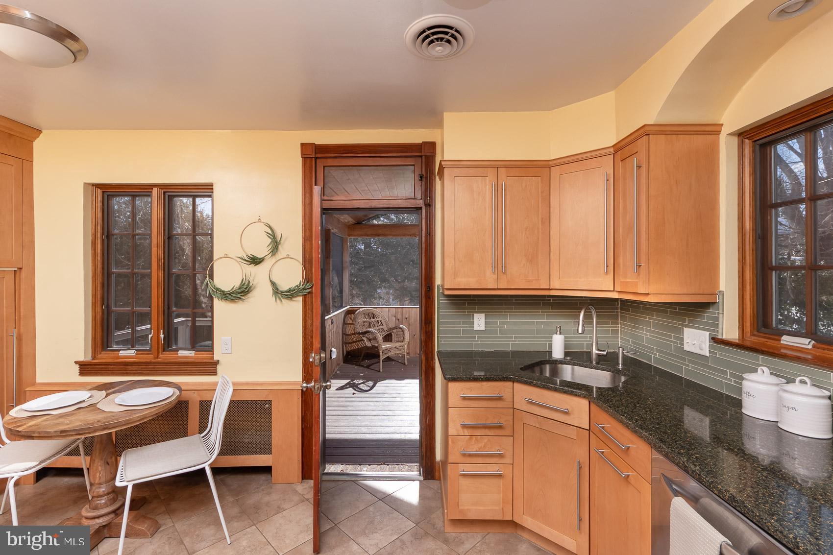 613 Anneslie Road Baltimore, MD 21212 - Photo 11 of 48 a kitchen that has a cabinets counter space and a window