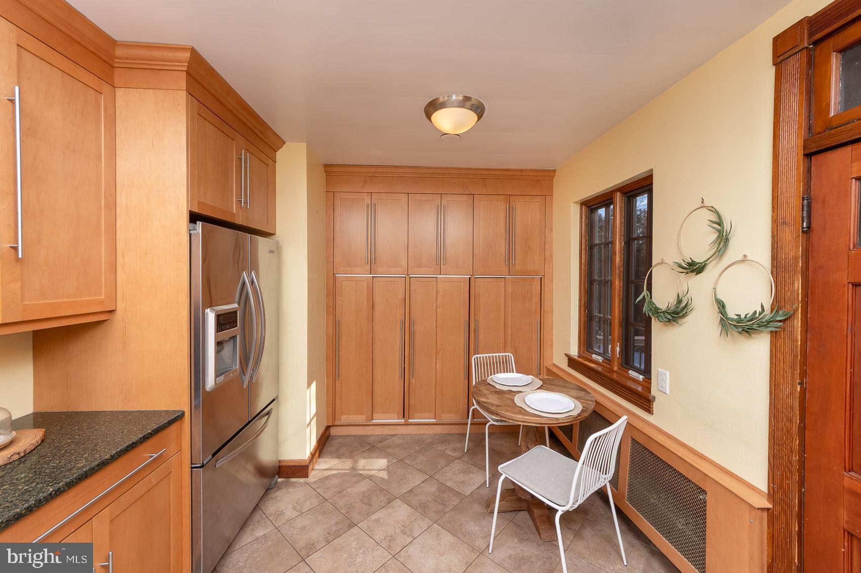 613 Anneslie Road Baltimore, MD 21212 - Photo 12 of 48 a kitchen with a table and chairs