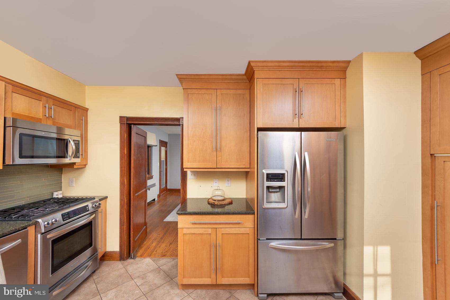613 Anneslie Road Baltimore, MD 21212 - Photo 13 of 48 a kitchen with stainless steel appliances granite countertop a refrigerator stove and oven