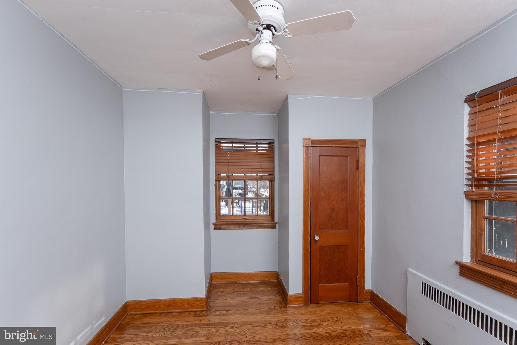 613 Anneslie Road Baltimore, MD 21212 - Photo 30 of 48 a view of an empty room with window and wooden floor