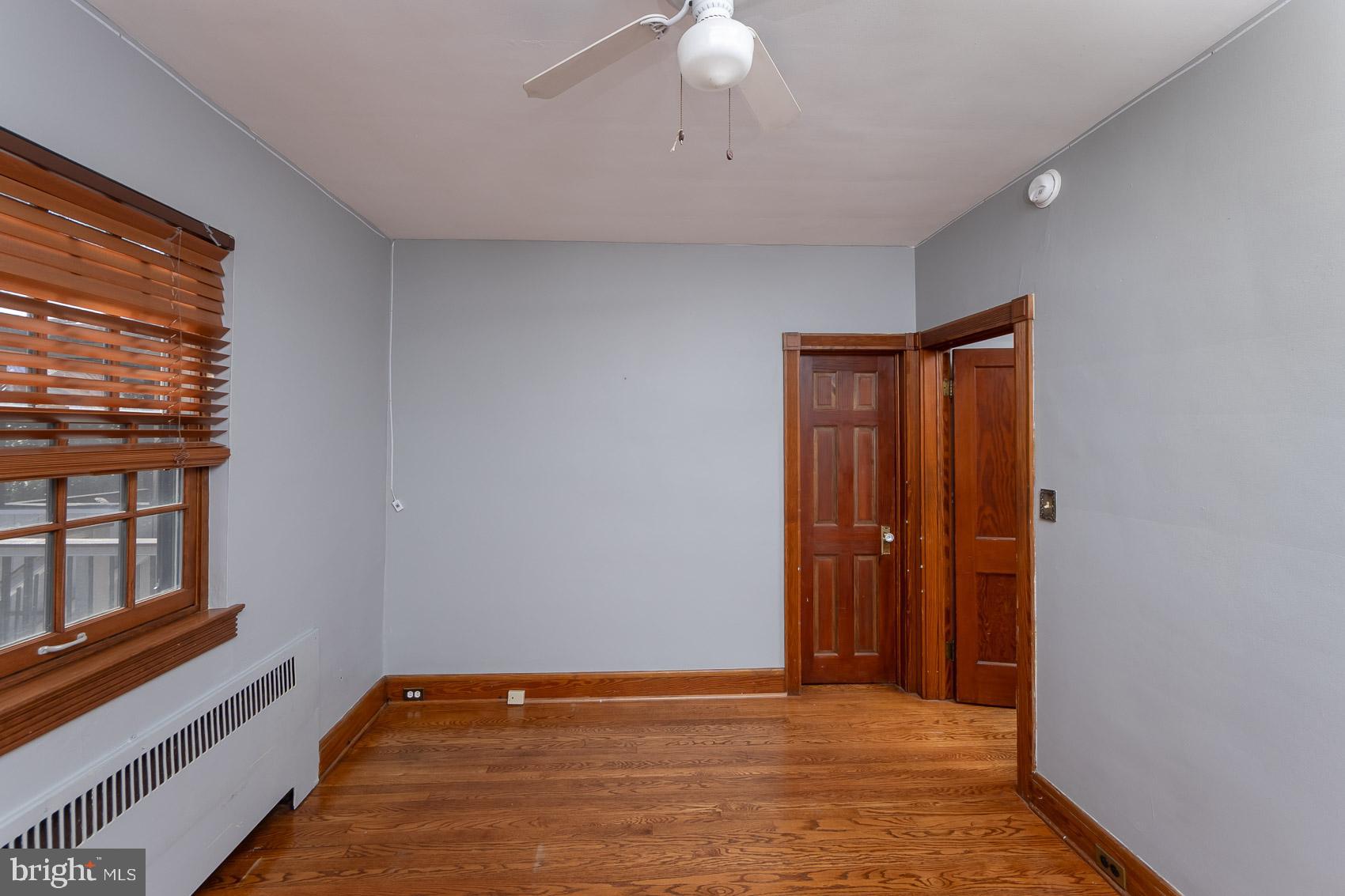 613 Anneslie Road Baltimore, MD 21212 - Photo 31 of 48 a view of an empty room with window and wooden floor